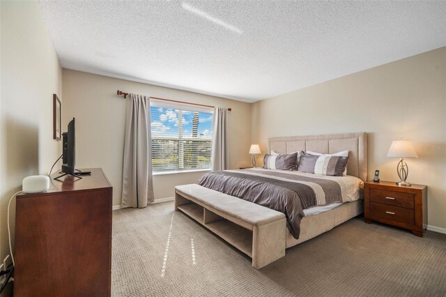 1048 Lake Berkley Dr, Kissimmee, FL 34746 - carpeted bedroom with baseboards and a textured ceiling