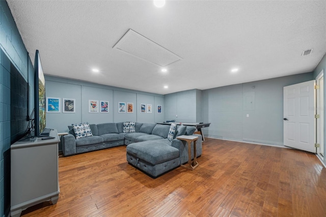 1048 Lake Berkley Dr, Kissimmee, FL 34746 - living area with visible vents, recessed lighting, attic access, and hardwood / wood-style floors