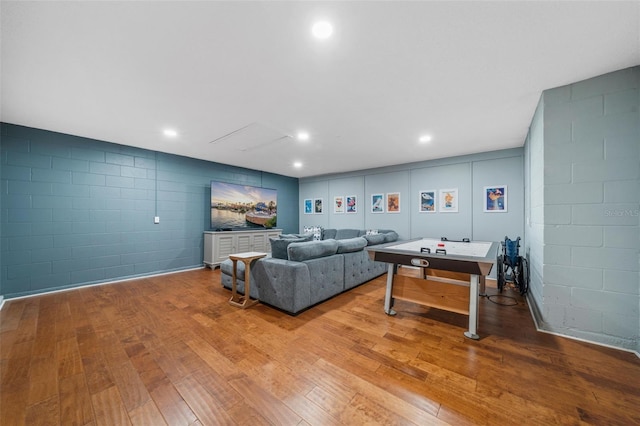 1048 Lake Berkley Dr, Kissimmee, FL 34746 - living room featuring wood-type flooring and concrete block wall