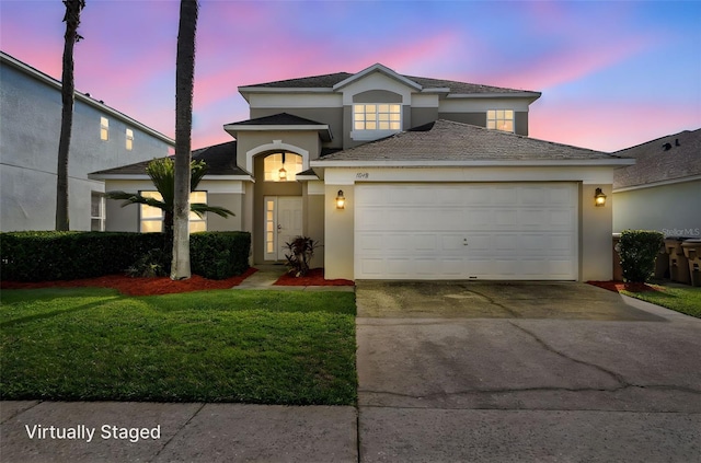 1048 Lake Berkley Dr, Kissimmee, FL 34746 - view of front of property with an attached garage, concrete driveway, stucco siding, and a front lawn