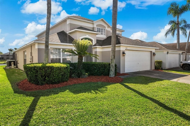 1048 Lake Berkley Dr, Kissimmee, FL 34746 - mediterranean / spanish-style house featuring a front lawn, stucco siding, an attached garage, and aphalt driveway