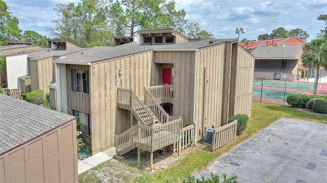 view of outbuilding featuring fence
