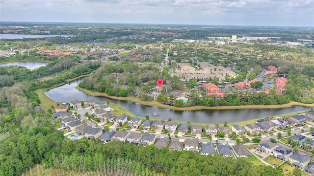 birds eye view of property with a water view and a residential view