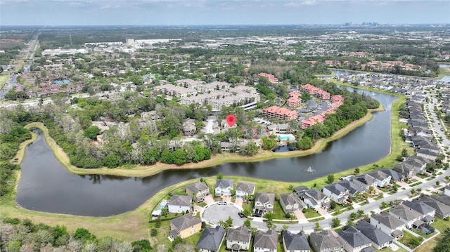 drone / aerial view with a water view and a residential view