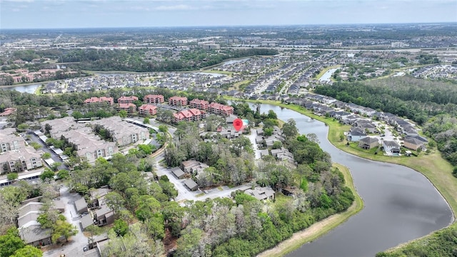 drone / aerial view featuring a residential view and a water view
