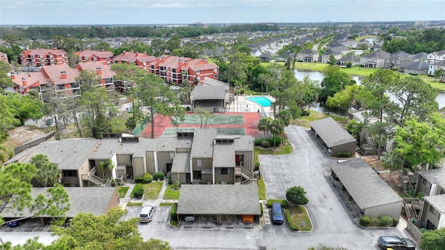 birds eye view of property featuring a water view and a residential view