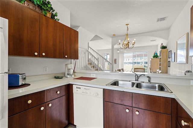 1149 S Beach Cir, Kissimmee, FL 34746 - kitchen featuring light countertops, dishwasher, visible vents, and a sink