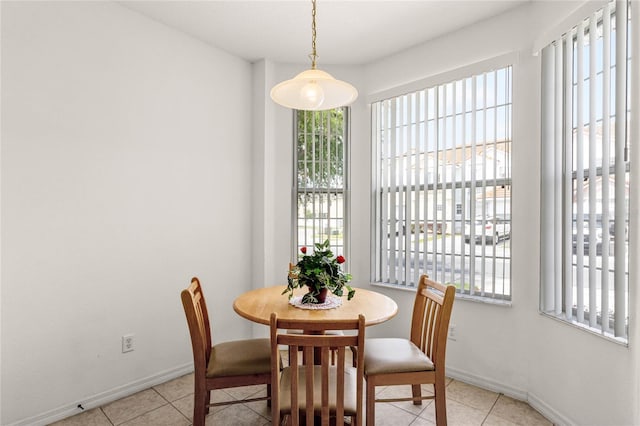 1149 S Beach Cir, Kissimmee, FL 34746 - dining area featuring light tile patterned flooring and baseboards