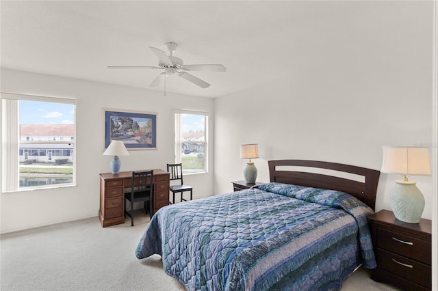 1149 S Beach Cir, Kissimmee, FL 34746 - carpeted bedroom with multiple windows and a ceiling fan