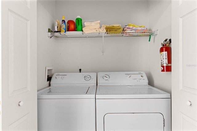 1149 S Beach Cir, Kissimmee, FL 34746 - clothes washing area with independent washer and dryer and laundry area