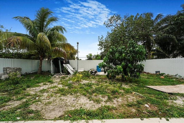 view of yard with a fenced backyard