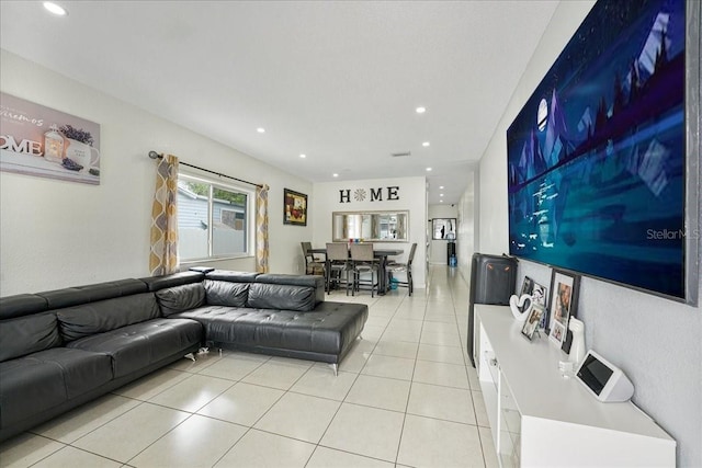 living room with light tile patterned floors and recessed lighting