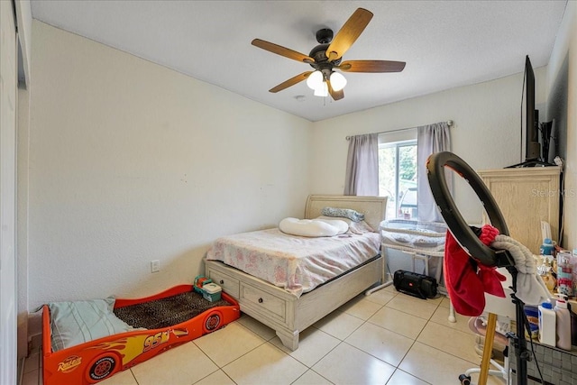 bedroom featuring light tile patterned floors and a ceiling fan
