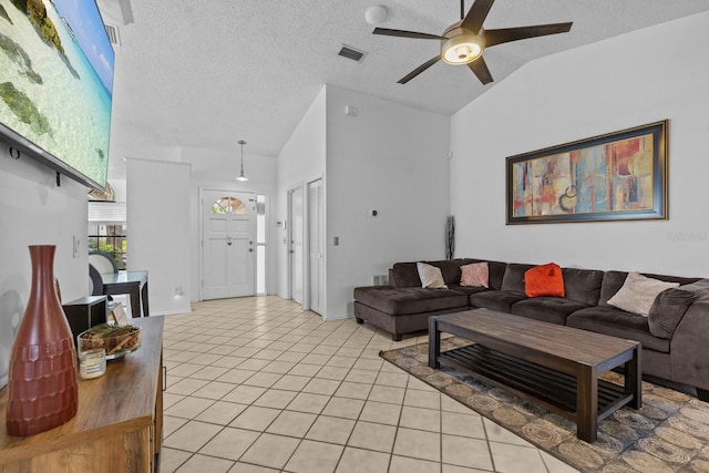 1345 Tindaro Dr, Apopka, FL 32703 - living area featuring lofted ceiling, a textured ceiling, light tile patterned flooring, visible vents, and a ceiling fan