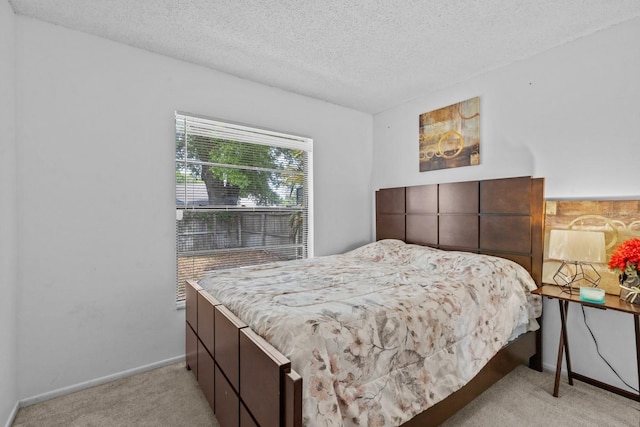 1345 Tindaro Dr, Apopka, FL 32703 - bedroom featuring light carpet, baseboards, and a textured ceiling
