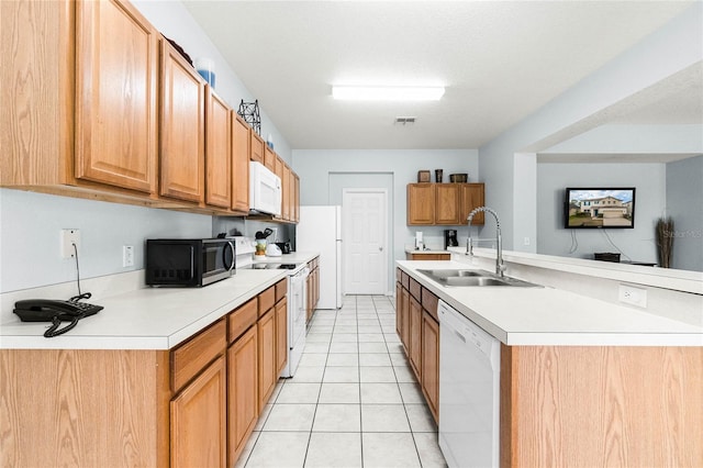 kitchen with light countertops, a sink, light tile patterned floors, white appliances, and visible vents