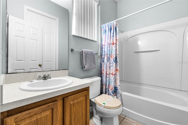 full bathroom featuring tile patterned floors, toilet, shower / tub combo with curtain, and vanity