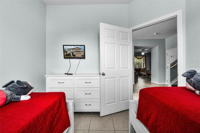 bedroom featuring light tile patterned flooring