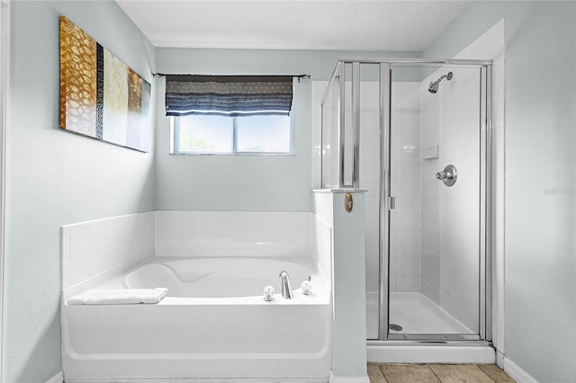 full bath with a garden tub and a shower stall