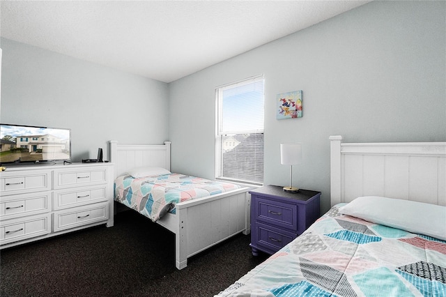 bedroom featuring dark colored carpet