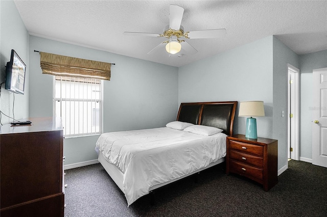 bedroom with baseboards, ceiling fan, carpet, and a textured ceiling
