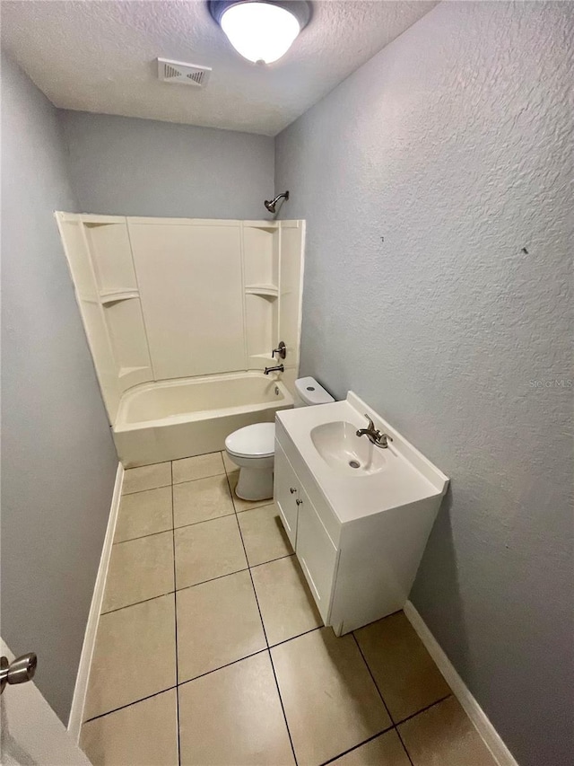 403 Terry St, Wildwood, FL 34785 - bathroom with tile patterned floors, toilet, bathing tub / shower combination, a textured ceiling, and visible vents