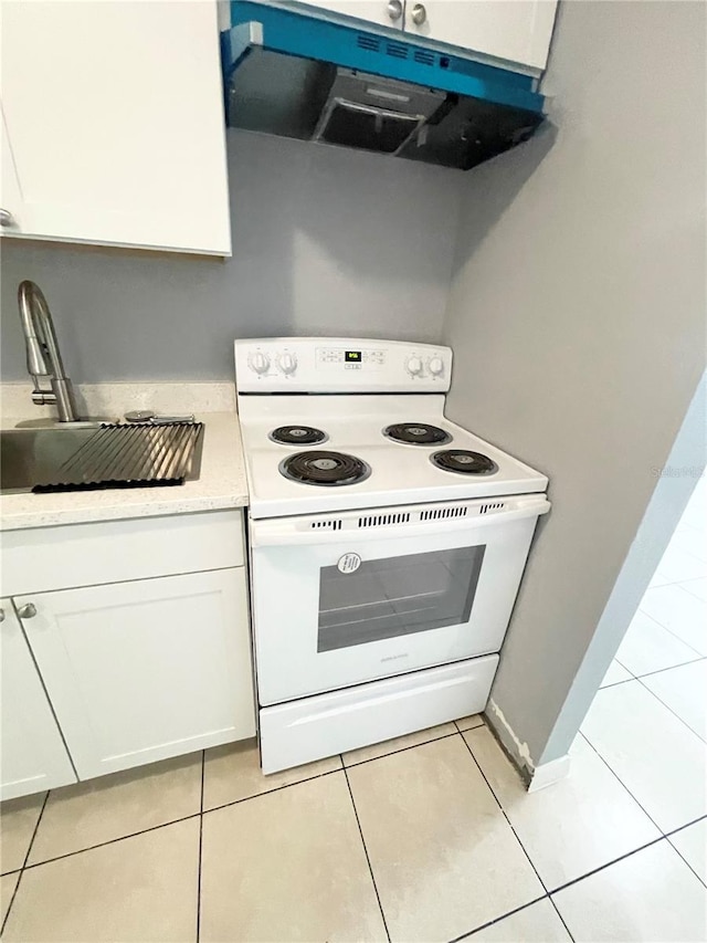 403 Terry St, Wildwood, FL 34785 - kitchen with extractor fan, white cabinets, a sink, and white range with electric cooktop