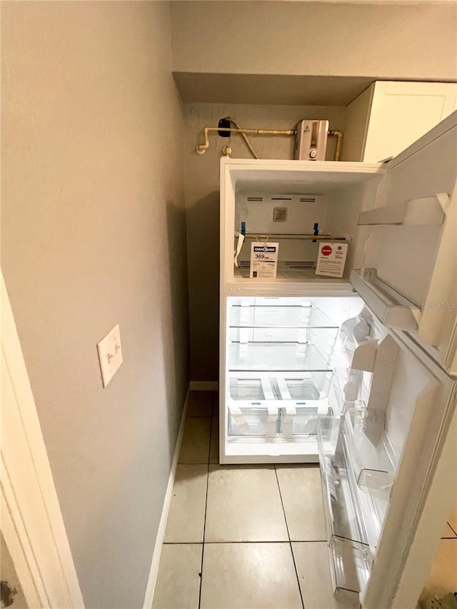 403 Terry St, Wildwood, FL 34785 - washroom featuring baseboards and light tile patterned floors