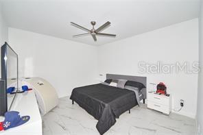 1237 Tallow Rd Unit 1237, Apopka, FL 32703 - bedroom featuring ceiling fan
