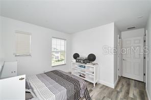 1237 Tallow Rd Unit 1237, Apopka, FL 32703 - bedroom featuring wood finished floors