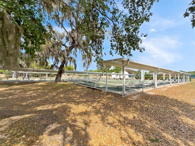 view of home's community featuring shuffleboard