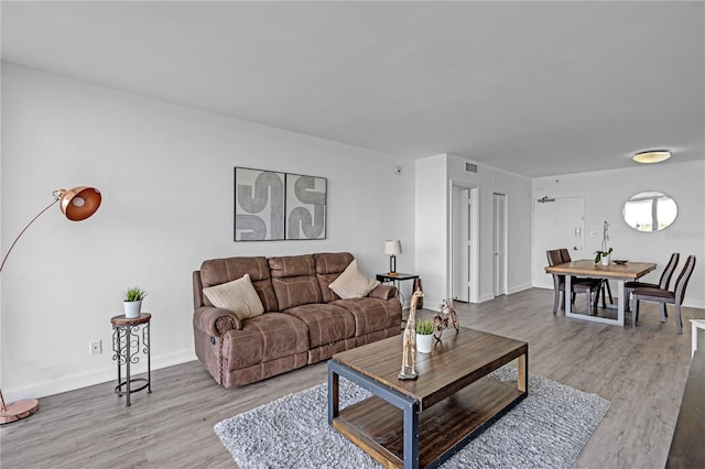 5600 Collins Ave Unit 6P, Miami Beach, FL 33140 - living room featuring wood finished floors and baseboards