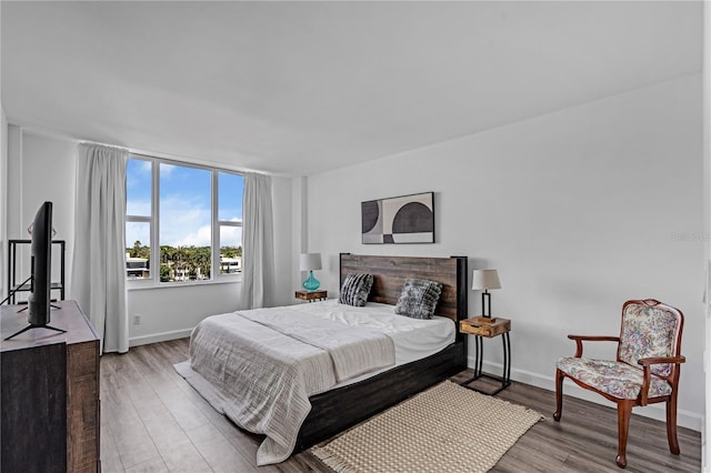 5600 Collins Ave Unit 6P, Miami Beach, FL 33140 - bedroom with wood finished floors and baseboards
