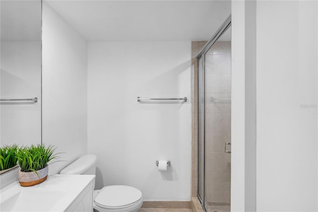 5600 Collins Ave Unit 6P, Miami Beach, FL 33140 - bathroom featuring vanity, toilet, a stall shower, and tile patterned flooring