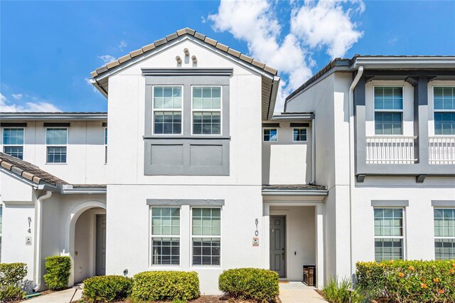 510 Captiva Dr, Davenport, FL 33896 - townhome / multi-family property with a tile roof and stucco siding