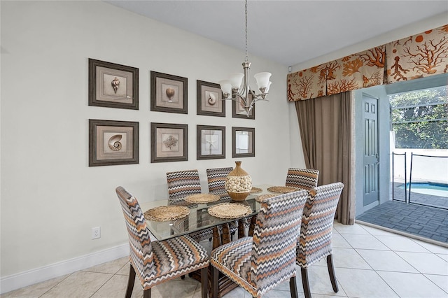 510 Captiva Dr, Davenport, FL 33896 - dining space with baseboards, light tile patterned floors, and an inviting chandelier
