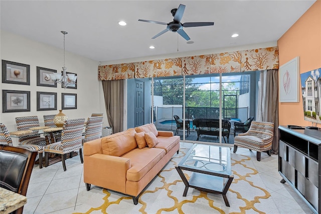510 Captiva Dr, Davenport, FL 33896 - living room with light tile patterned floors, recessed lighting, and ceiling fan with notable chandelier