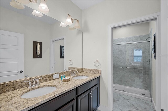 510 Captiva Dr, Davenport, FL 33896 - full bathroom featuring double vanity, a sink, a stall shower, and toilet