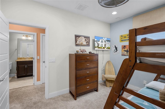 510 Captiva Dr, Davenport, FL 33896 - bedroom with ensuite bathroom, visible vents, baseboards, recessed lighting, and light colored carpet