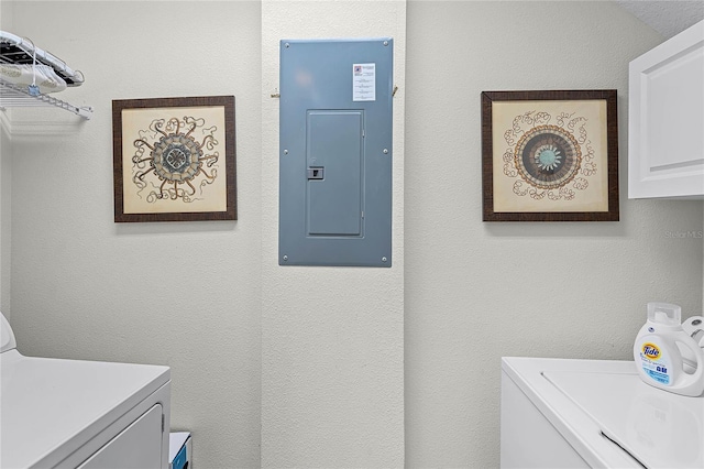 510 Captiva Dr, Davenport, FL 33896 - laundry room featuring a textured wall, cabinet space, independent washer and dryer, and electric panel