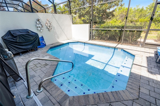 510 Captiva Dr, Davenport, FL 33896 - pool featuring a grill, a lanai, and a patio
