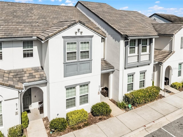 510 Captiva Dr, Davenport, FL 33896 - townhome / multi-family property featuring stucco siding and a tiled roof