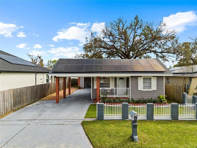 view of front of property with an attached carport, a fenced front yard, a front lawn, driveway, and a porch
