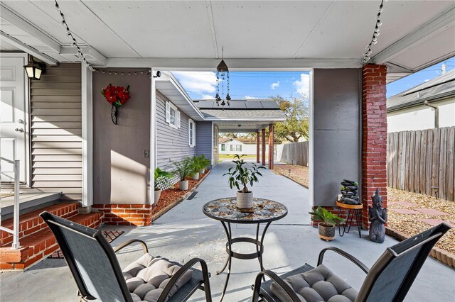view of patio featuring fence