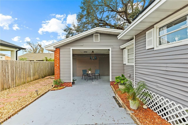 view of patio featuring fence