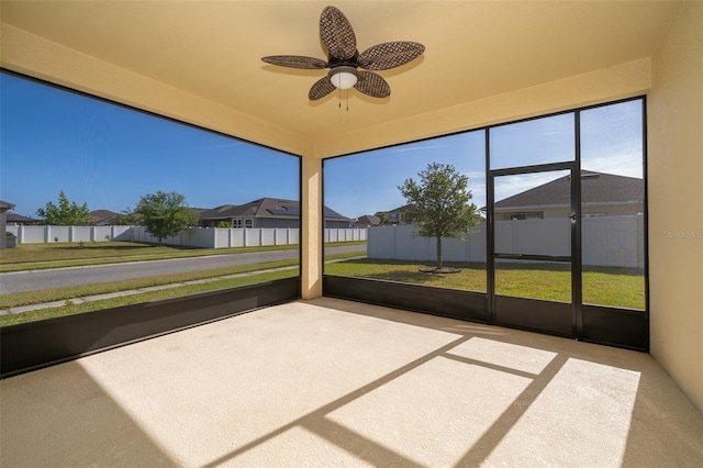 unfurnished sunroom featuring a residential view