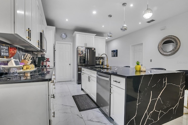 2566 Trielle Ave, Kissimmee, FL 34741 - kitchen with a sink, dark countertops, stainless steel appliances, marble finish floor, and visible vents