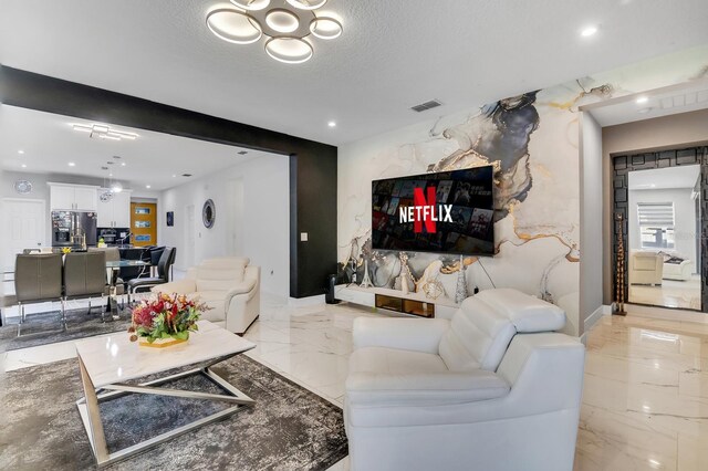 2566 Trielle Ave, Kissimmee, FL 34741 - living area with marble finish floor, visible vents, recessed lighting, and a textured ceiling