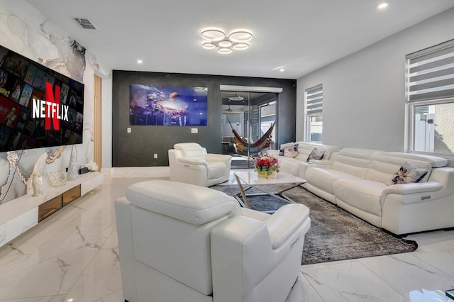 2566 Trielle Ave, Kissimmee, FL 34741 - living room featuring marble finish floor, visible vents, and recessed lighting