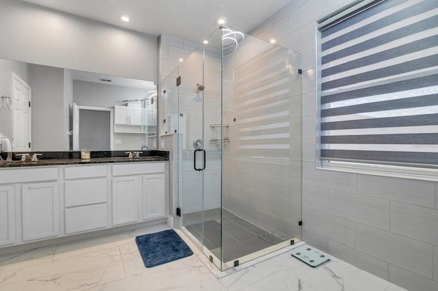 2566 Trielle Ave, Kissimmee, FL 34741 - full bath with marble finish floor, double vanity, a sink, and a shower stall
